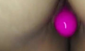 Seductive transexual using a vibrator during strips.