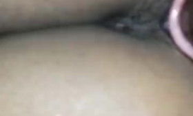 Black babe with small tits is getting her pussy fingered and assfucked in the living room.