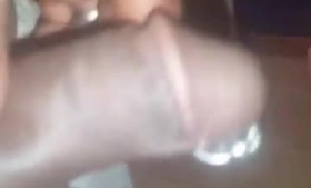 Blackette with pierced nipples is sucking her boyfriend's dick and getting ready to ride it