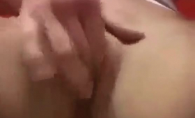 Blonde woman is getting throatfucked and touching her sex hungry pussy, while standing
